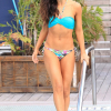 Karina Smirnoff in a blue print bikini as she suns herself in Miami